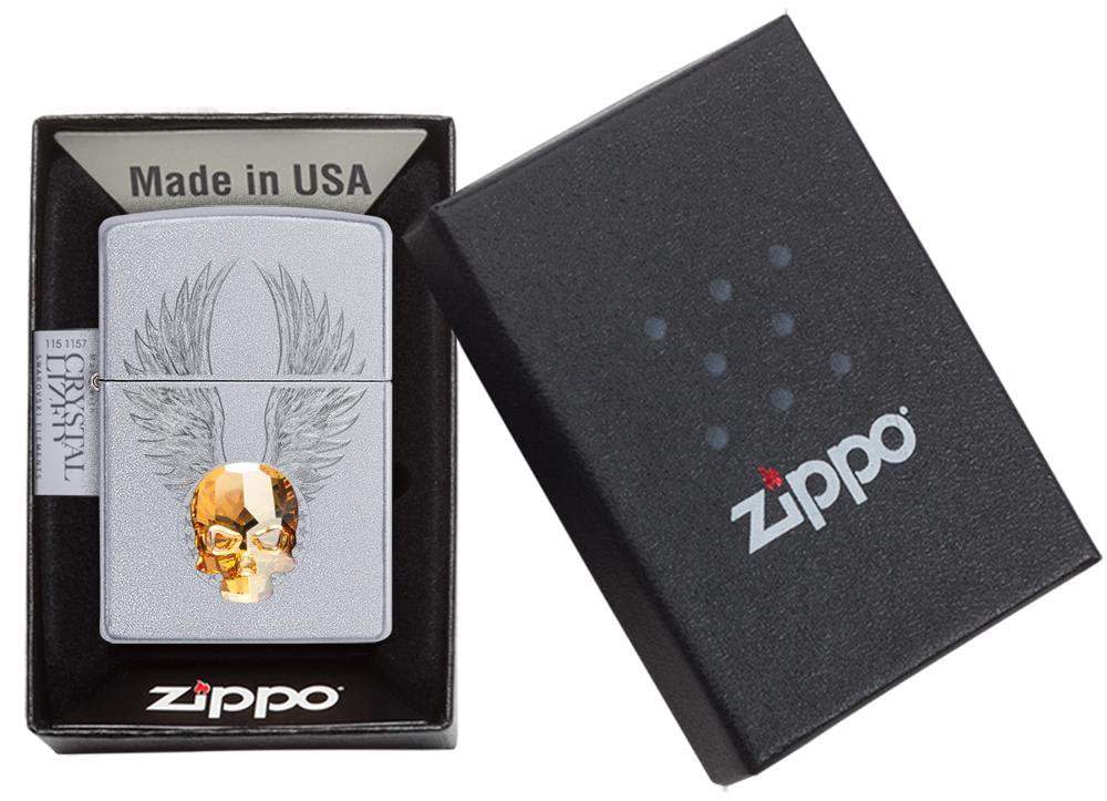 Front view of the Gold Skull Design Lighter with Skull Emblem in one box packaging